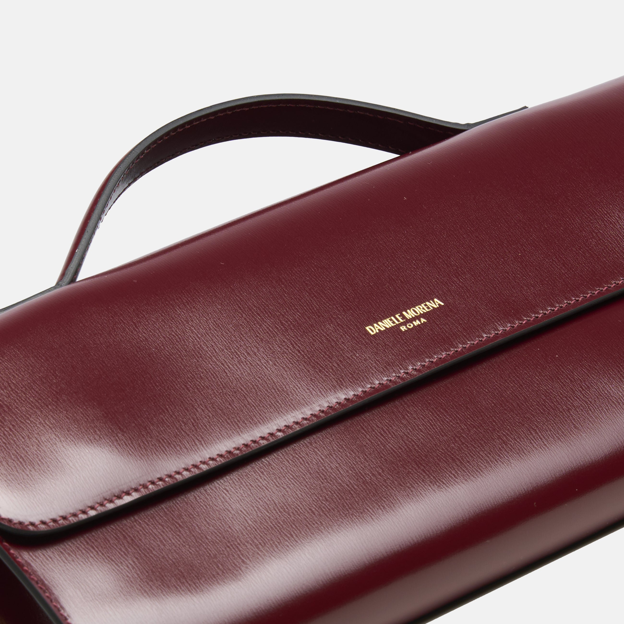BÉA CLUTCH BAG in burgundy calfskin box