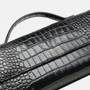 BÉA CLUTCH BAG in black crocodile skin