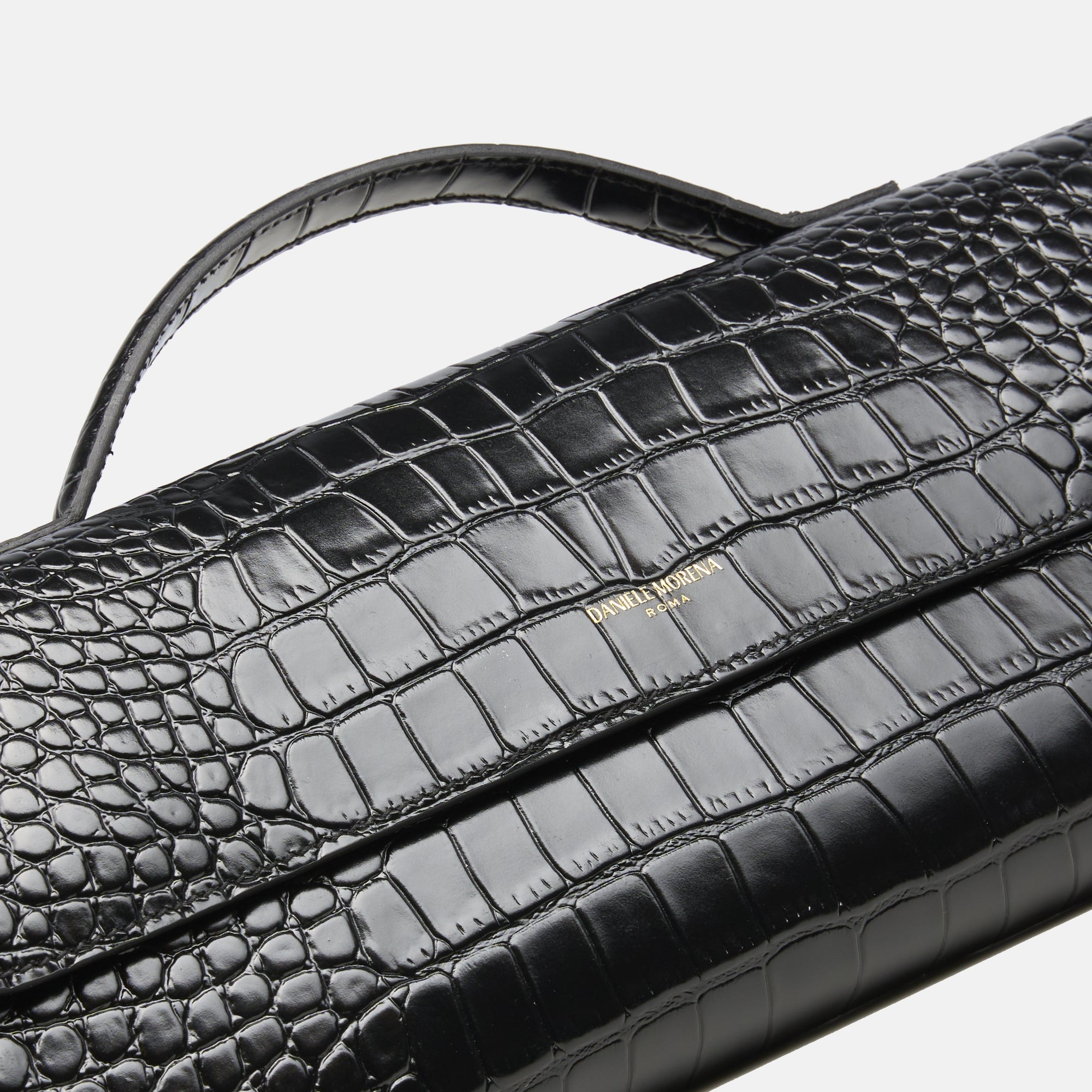 BÉA CLUTCH BAG in black crocodile skin