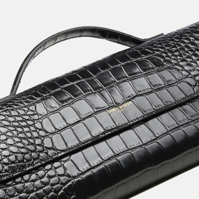 BÉA CLUTCH BAG in black crocodile skin